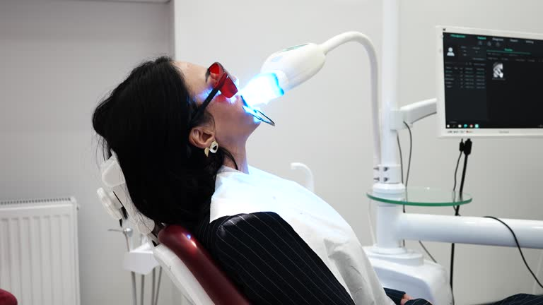photo of a woman during teeth whitening