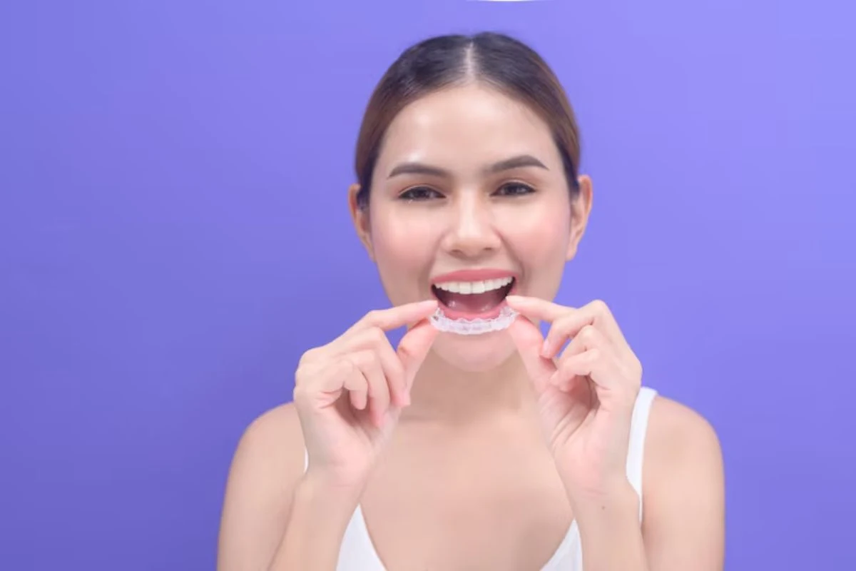 Woman Wearing Clear Invisalign Aligners For Teeth Straightening Treatment